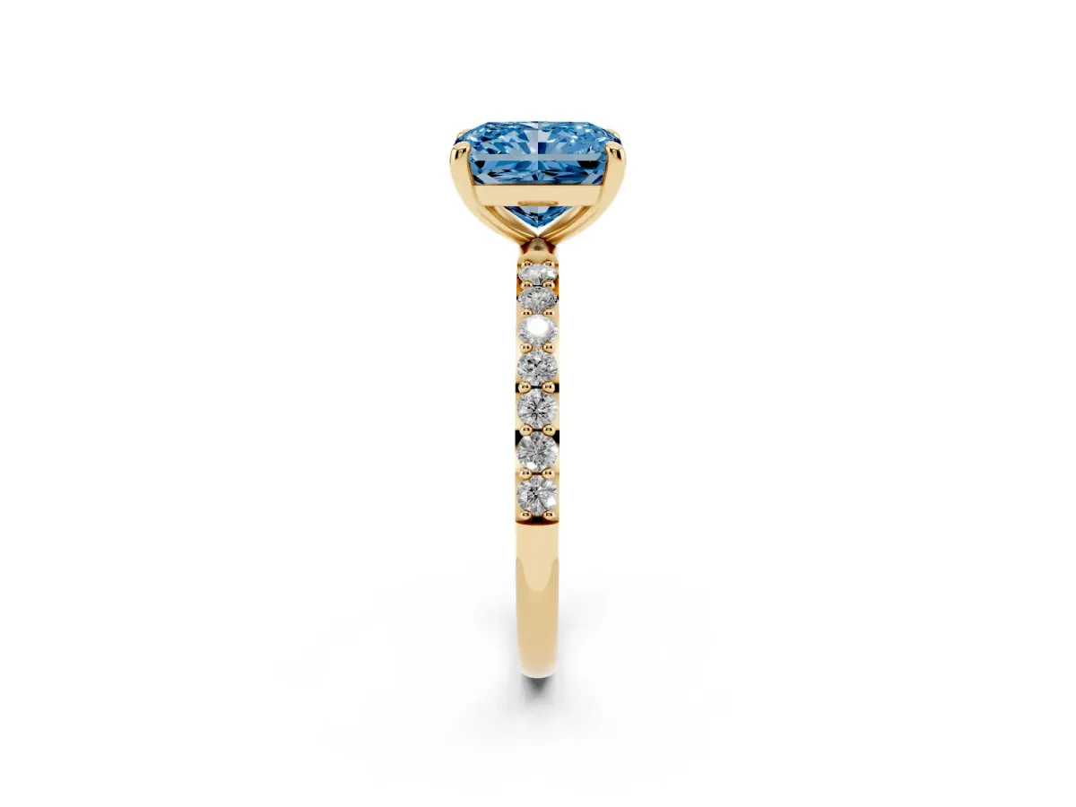 Fancy Blue Radiant Cut Diamond Solitaire Ring with Round Pavé Band and Prong Setting Yellow gold