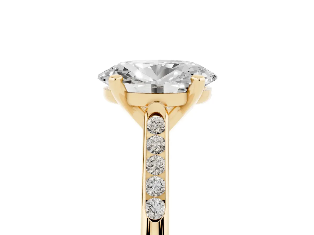 Oval Cut Diamond Solitaire Ring with Channel Set Round Band and Prong Setting Yellow gold