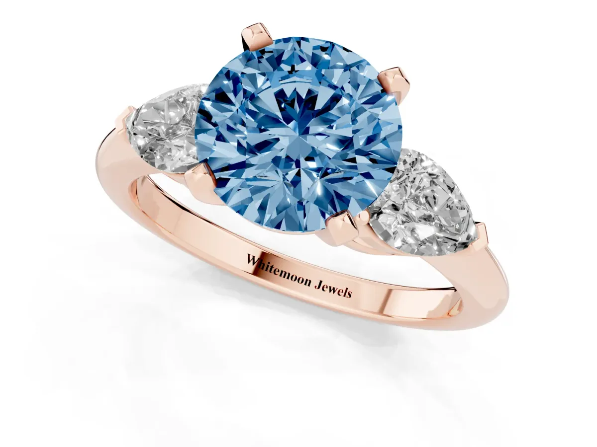 Fancy Blue Three-Stone Round Cut Diamond Ring with Pear Side Stones and Four-Prong Setting Rose gold