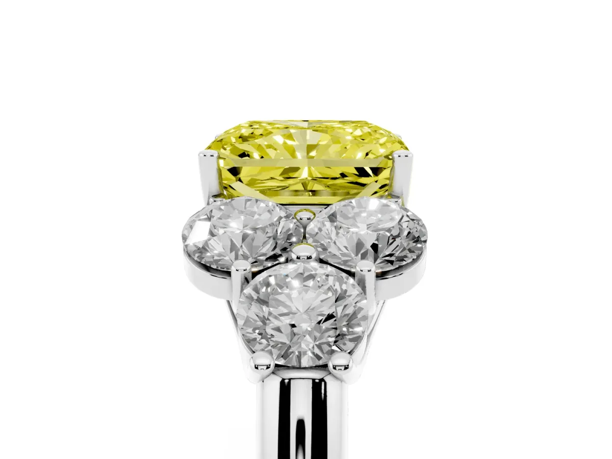 Fancy Yellow Radiant Cut Cut Diamond Cluster Ring with Round Accent Stones and Prong Setting on a Classic Band Platinum