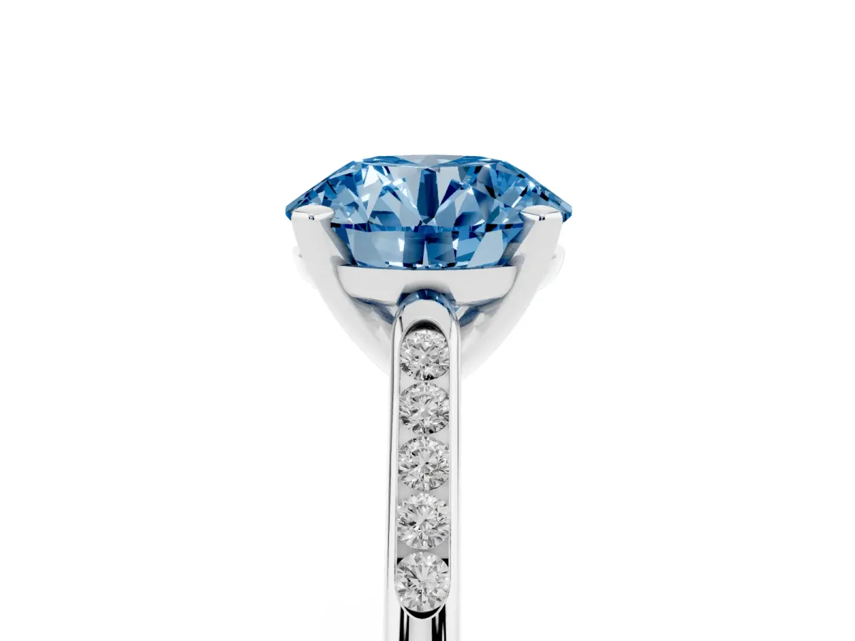 Fancy Blue Round Cut Diamond Solitaire Ring with Channel Set Round Band and Prong Setting Silver