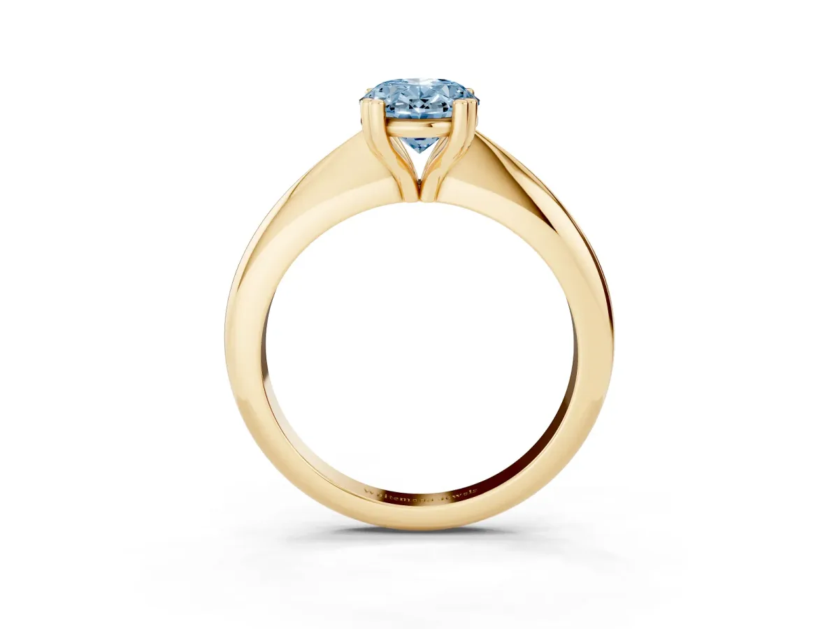 Fancy Blue Oval Cut Cut Solitaire Engagement Ring with Tapered Band and Four-Prong Setting Yellow gold