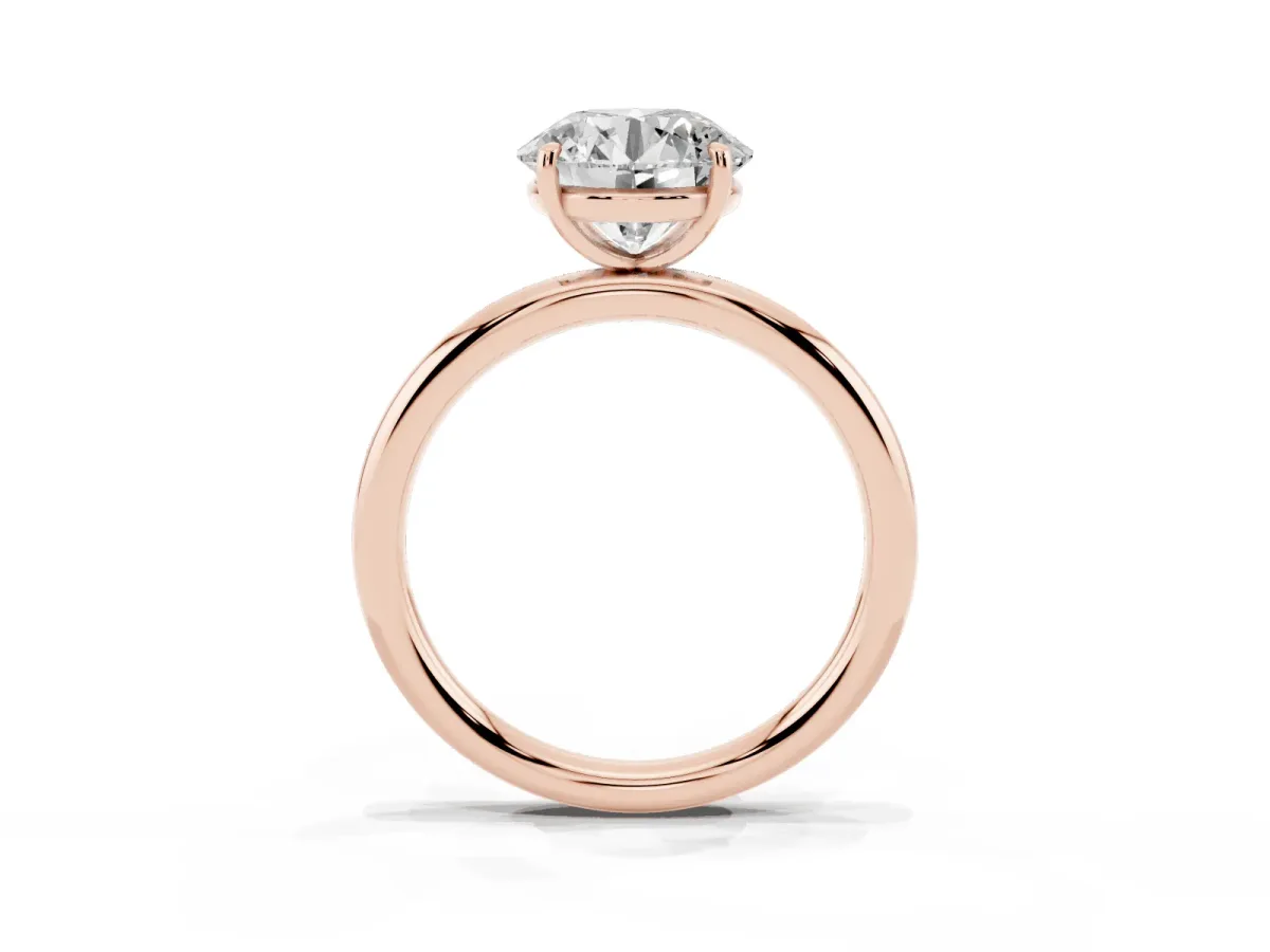 Round Cut Solitaire Diamond Ring with Four-Prong Setting on a Plain Band Rose gold