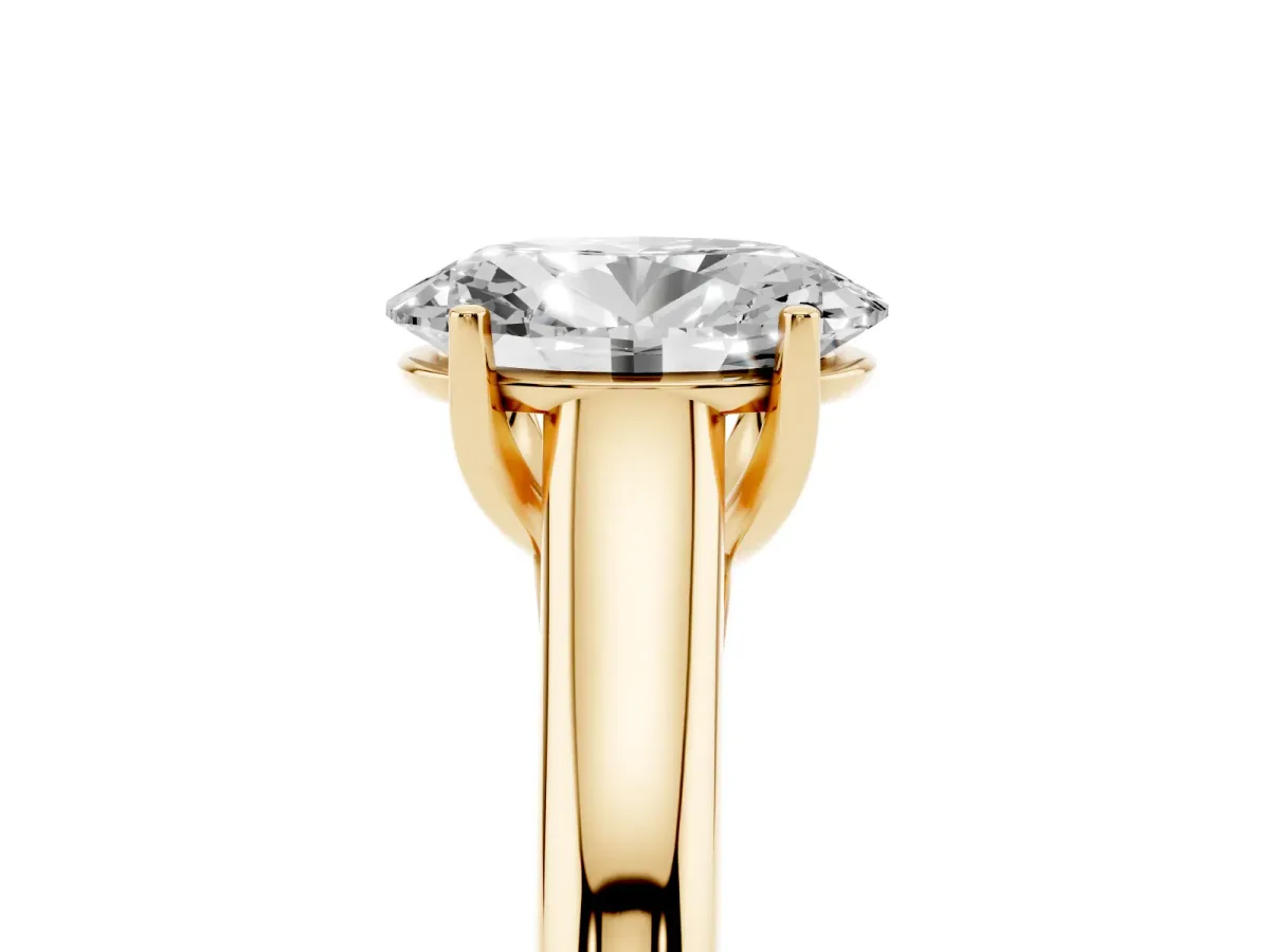 Oval Cut Solitaire Engagement Ring with Tapered Band and Four-Prong Setting Yellow gold