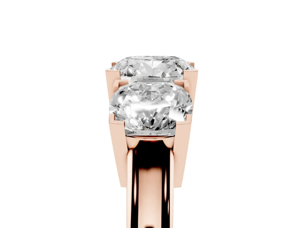 Three-Stone Cushion Cut Cut Diamond Ring with Channel Set Band and Four-Prong Setting Rose gold