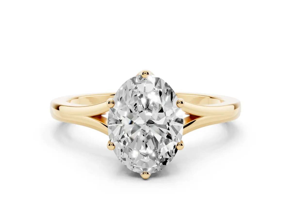 Oval Cut Solitaire Diamond Ring with Six-Prong Setting and Tapered Band Yellow gold