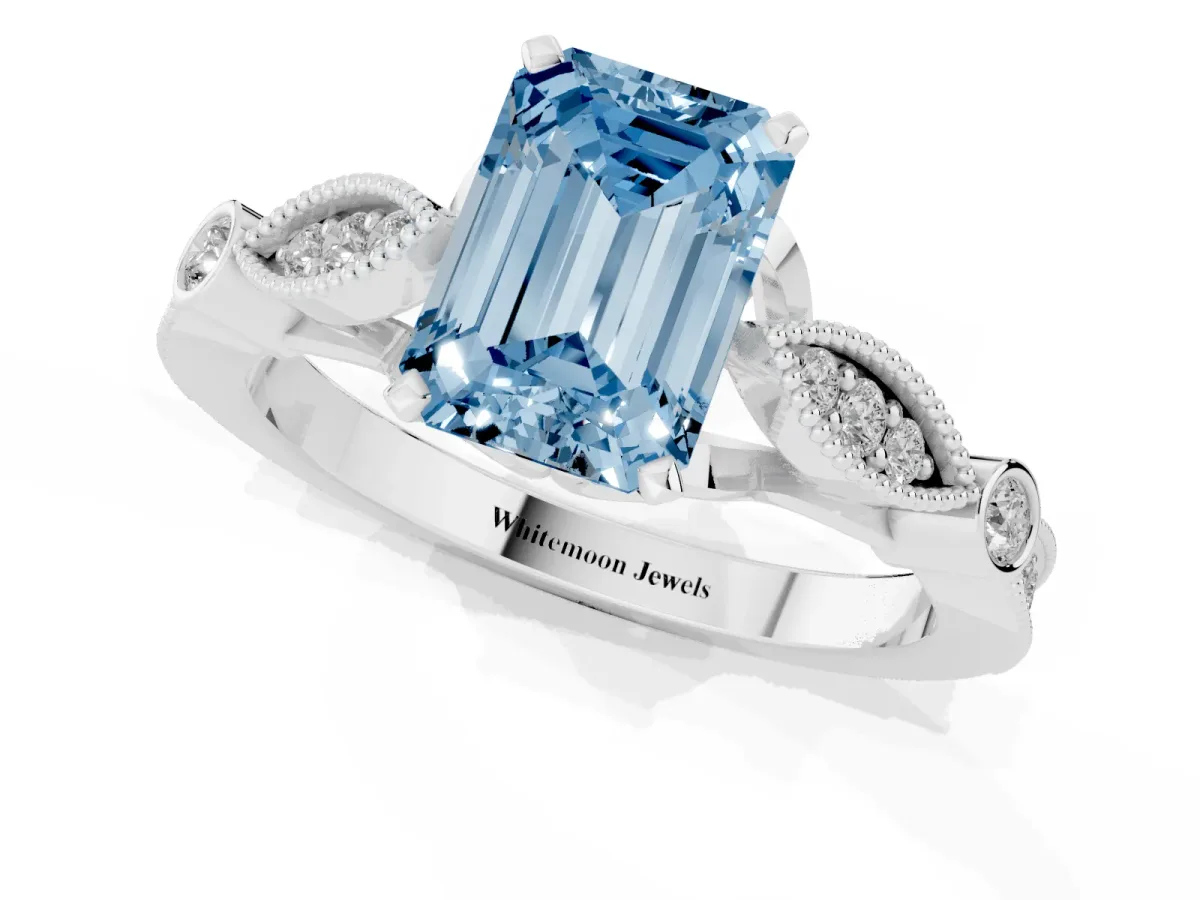 Fancy Blue Emerald Cut Cut Diamond with Milgrain Marquise and Bezel Accents on a Solitaire Band with Prong Setting Silver