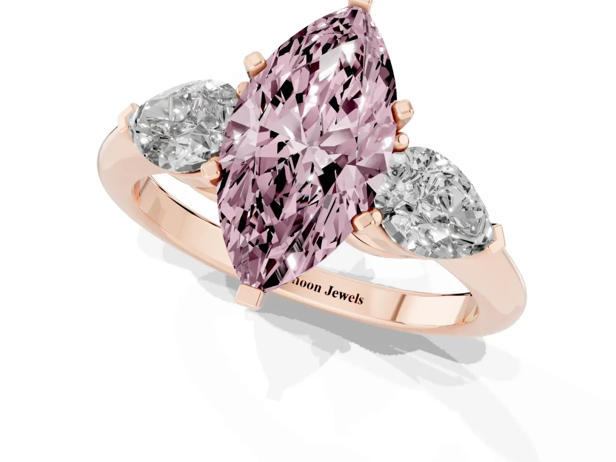 Fancy Pink Three-Stone Marquise Cut Diamond Ring with Pear Side Stones and Four-Prong Setting Rose gold