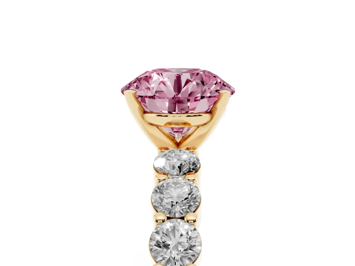 Fancy Pink Round Cut Diamond Solitaire Ring with Shared Prong Round Side Stones Yellow gold