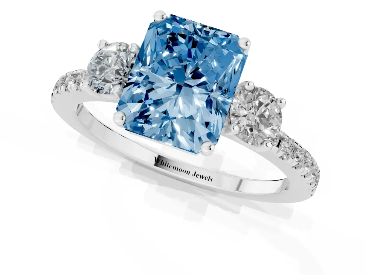 Fancy Blue Three-Stone Radiant Cut Cut Diamond Pavé Band with Prong Setting Platinum