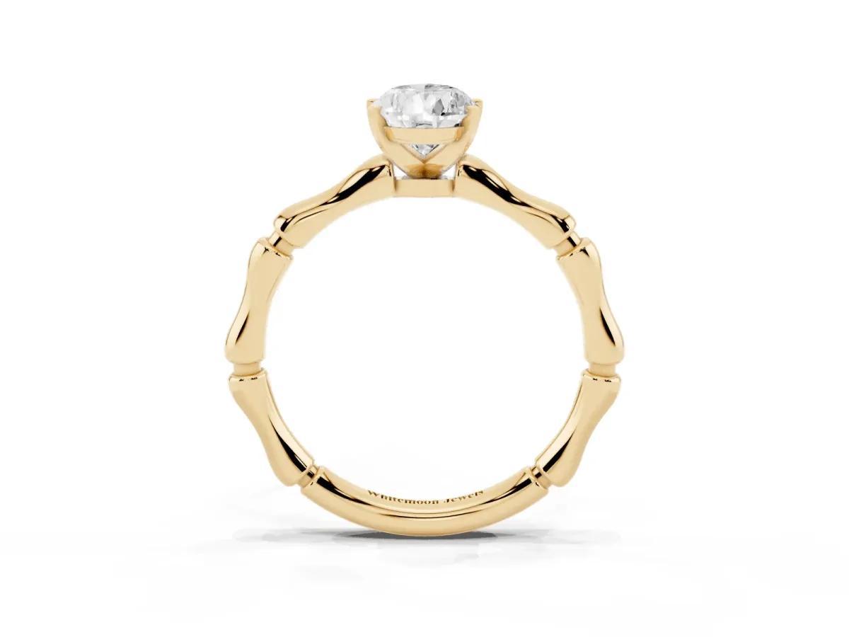 Pear Cut Solitaire Diamond Ring with Bamboo Band and Four-Prong Setting Yellow gold