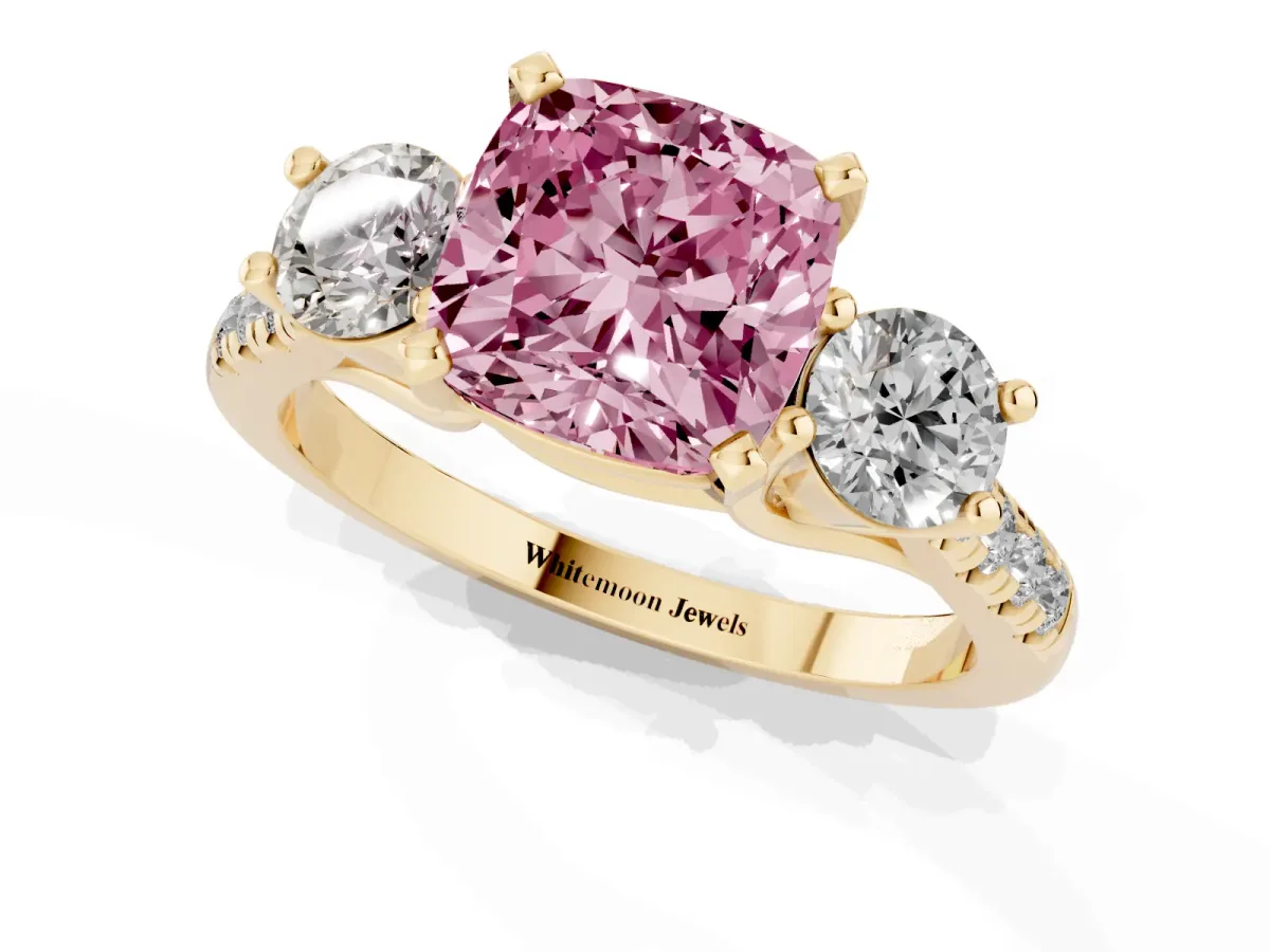 Fancy Pink Three-Stone Cushion Cut Diamond Pavé Band with Four-Prong Setting Yellow gold