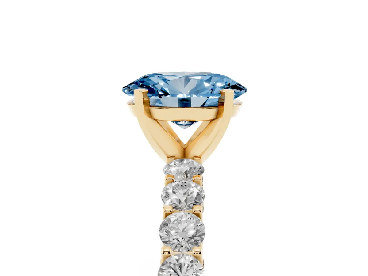 Fancy Blue Oval Cut Diamond Solitaire Ring with Shared Prong Pavé Band and Four-Prong Setting Yellow gold