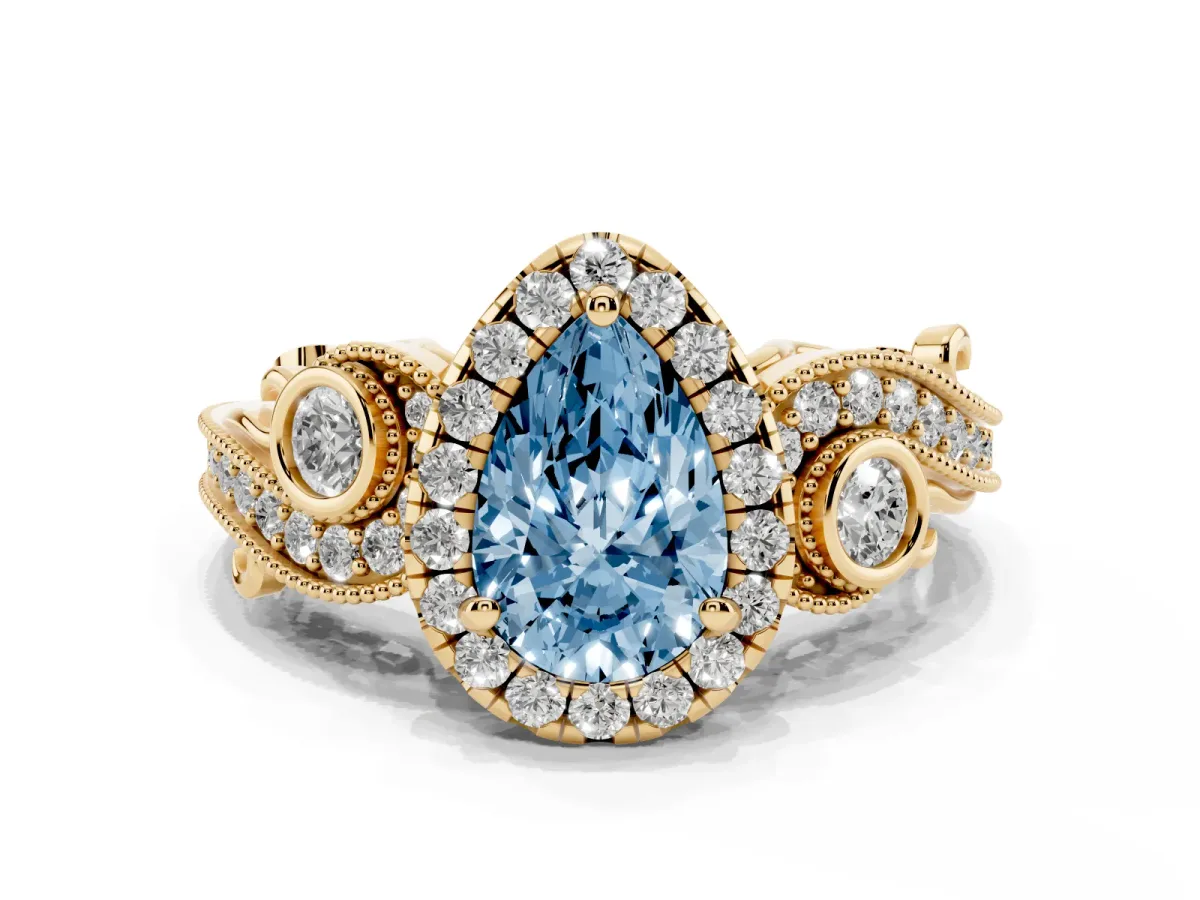 Fancy Blue Pear Cut Diamond Halo Ring with Milgrain Pavé Band and Four-Prong Setting Yellow gold