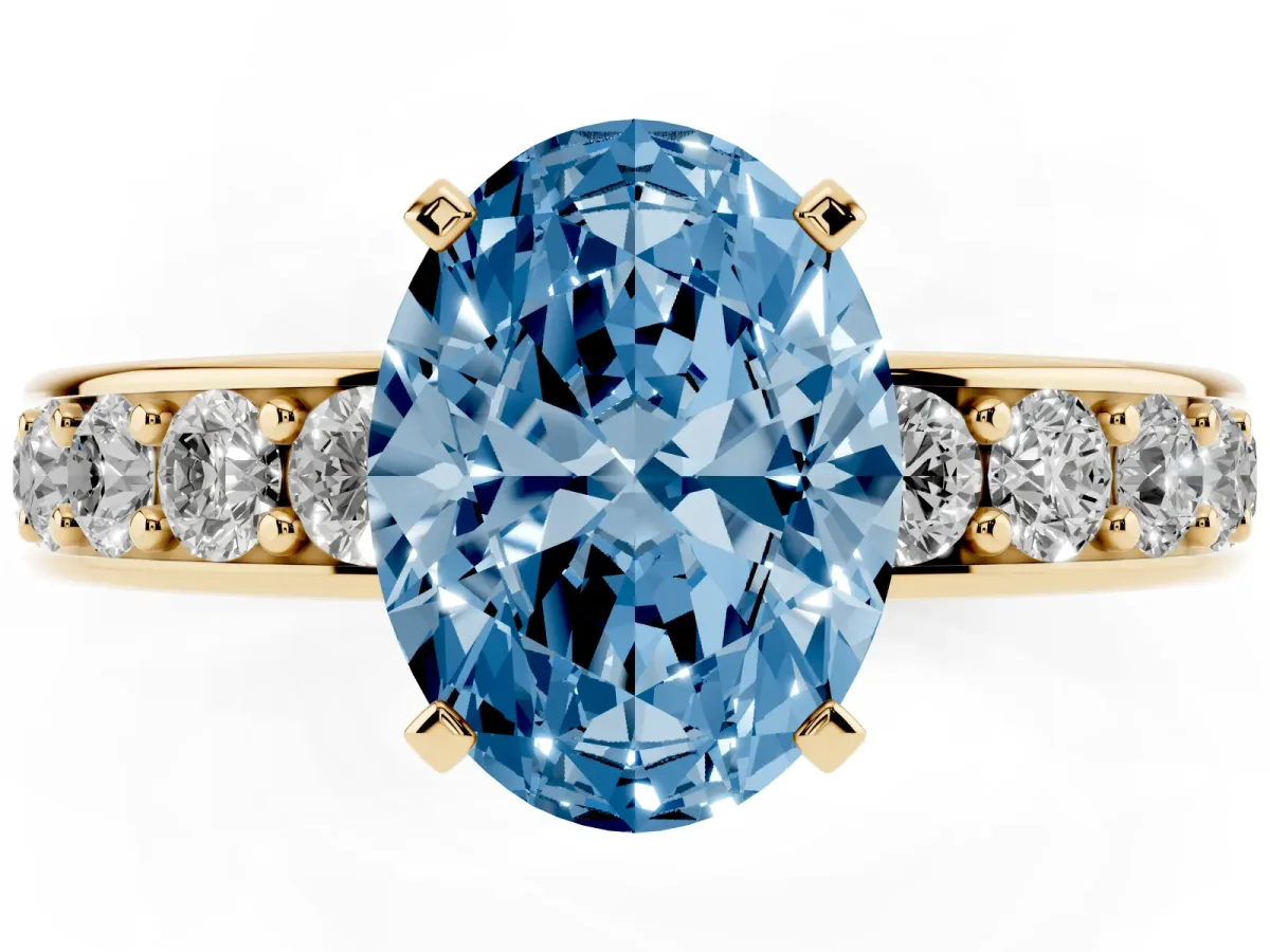 Fancy Blue Oval Cut Diamond Engagement Ring with Channel Set Round Band and Prong Setting Yellow gold