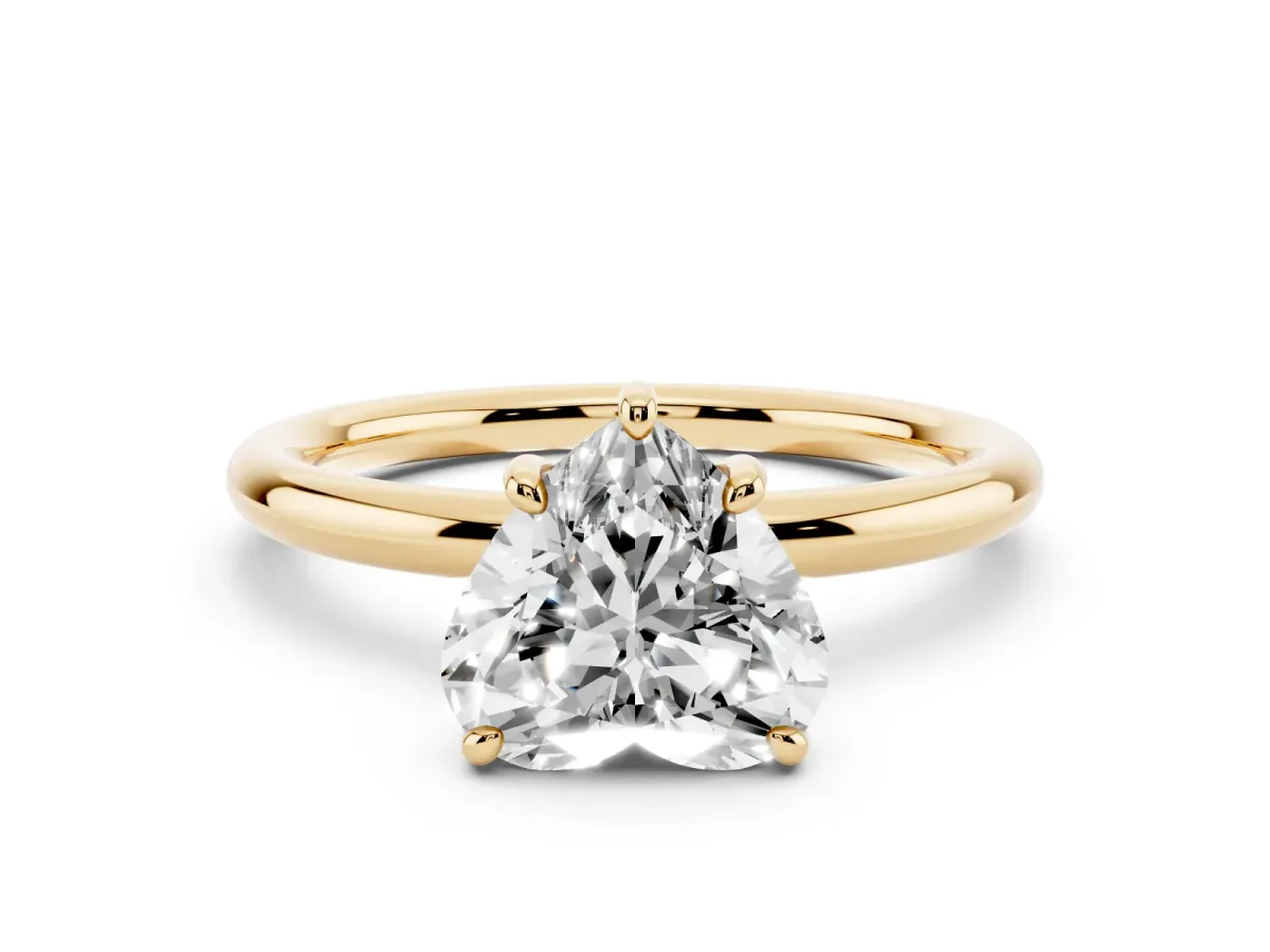 Heart Cut Solitaire Diamond Ring with Four-Prong Setting on a Plain Band Yellow gold