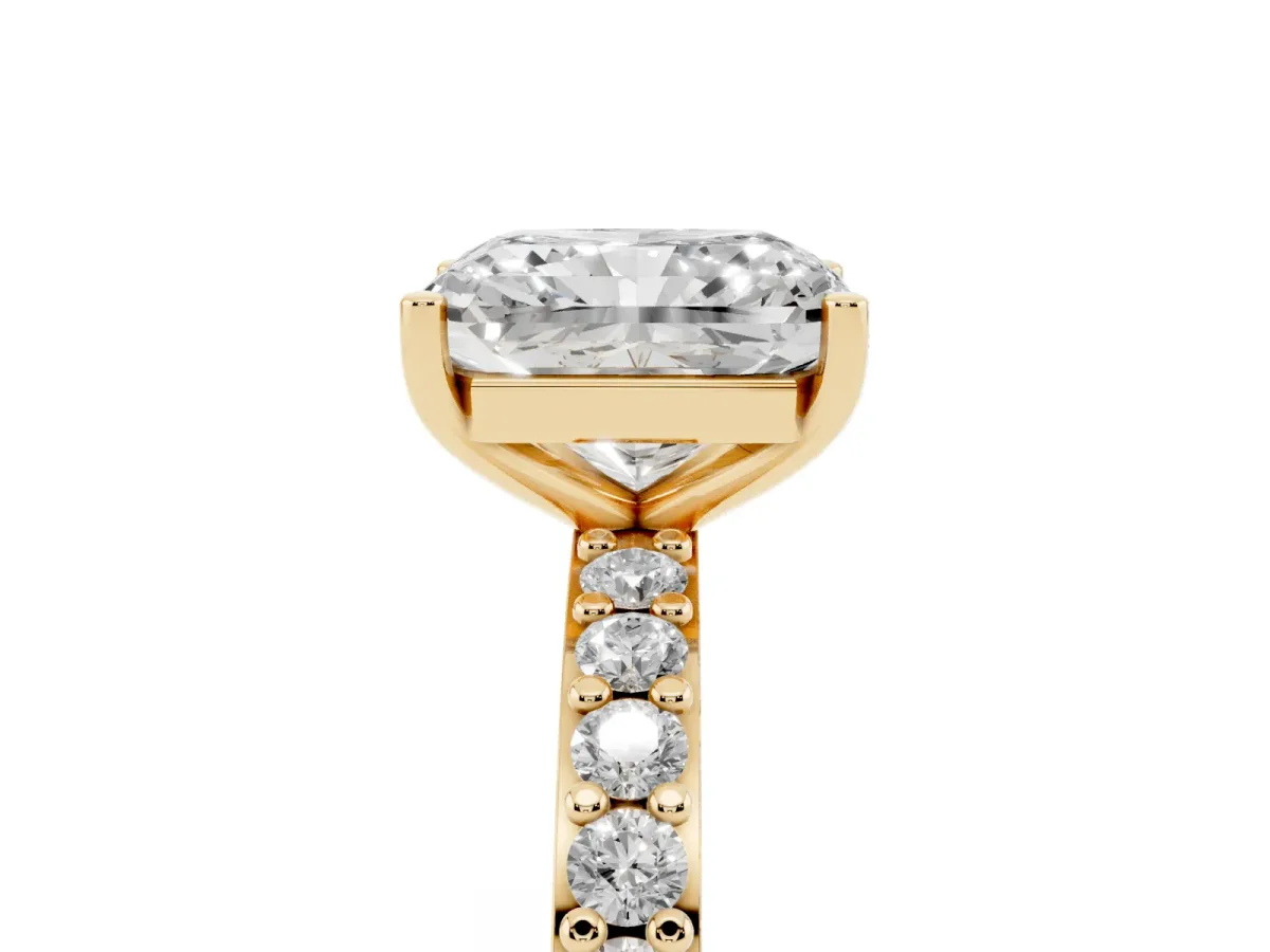 Radiant Cut Cut Diamond Solitaire with Pave Band and Four-Prong Setting Yellow gold