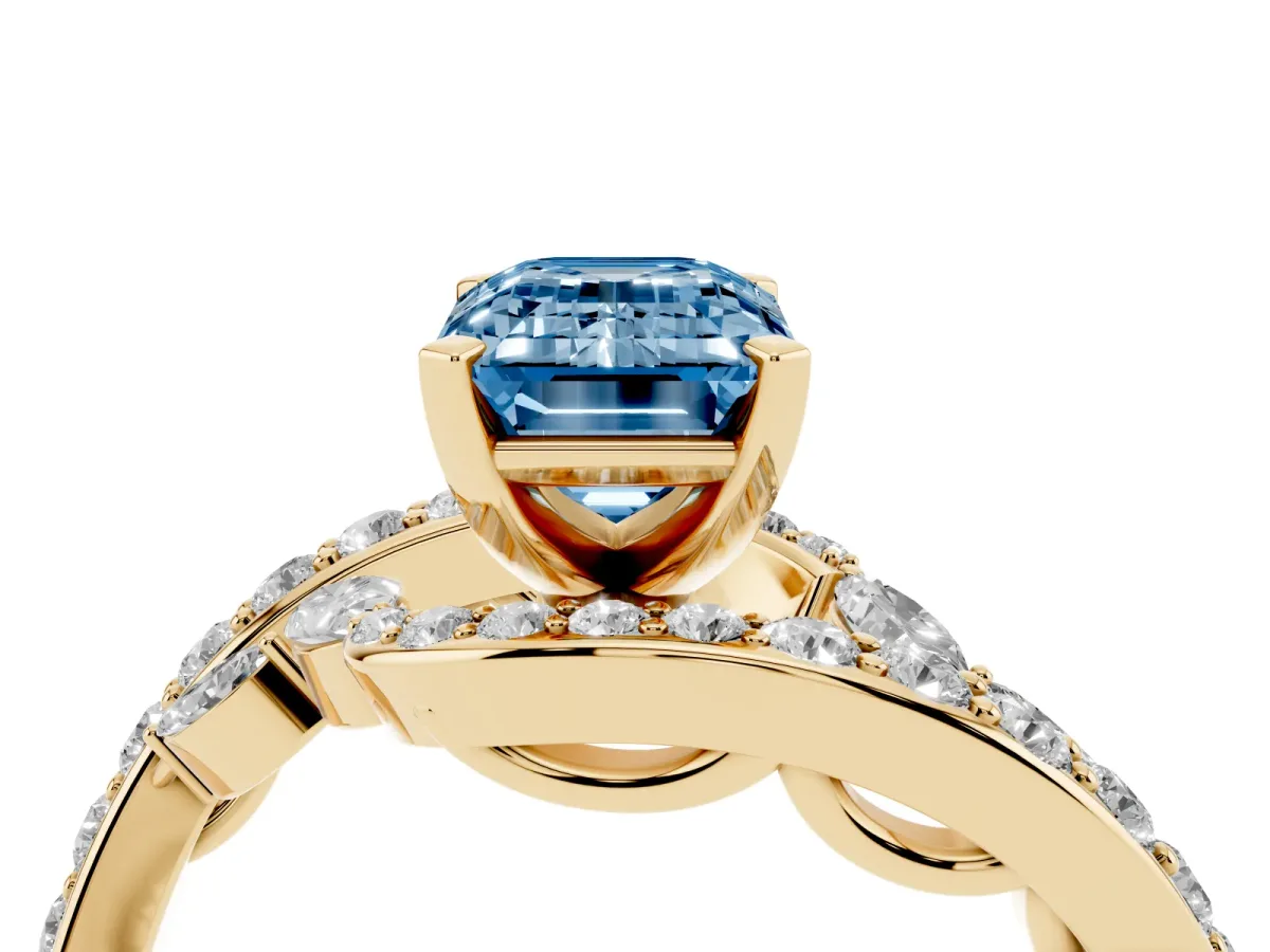 Fancy Blue Emerald Cut Solitaire with Pavé Twist Band and Four-Prong Setting Yellow gold