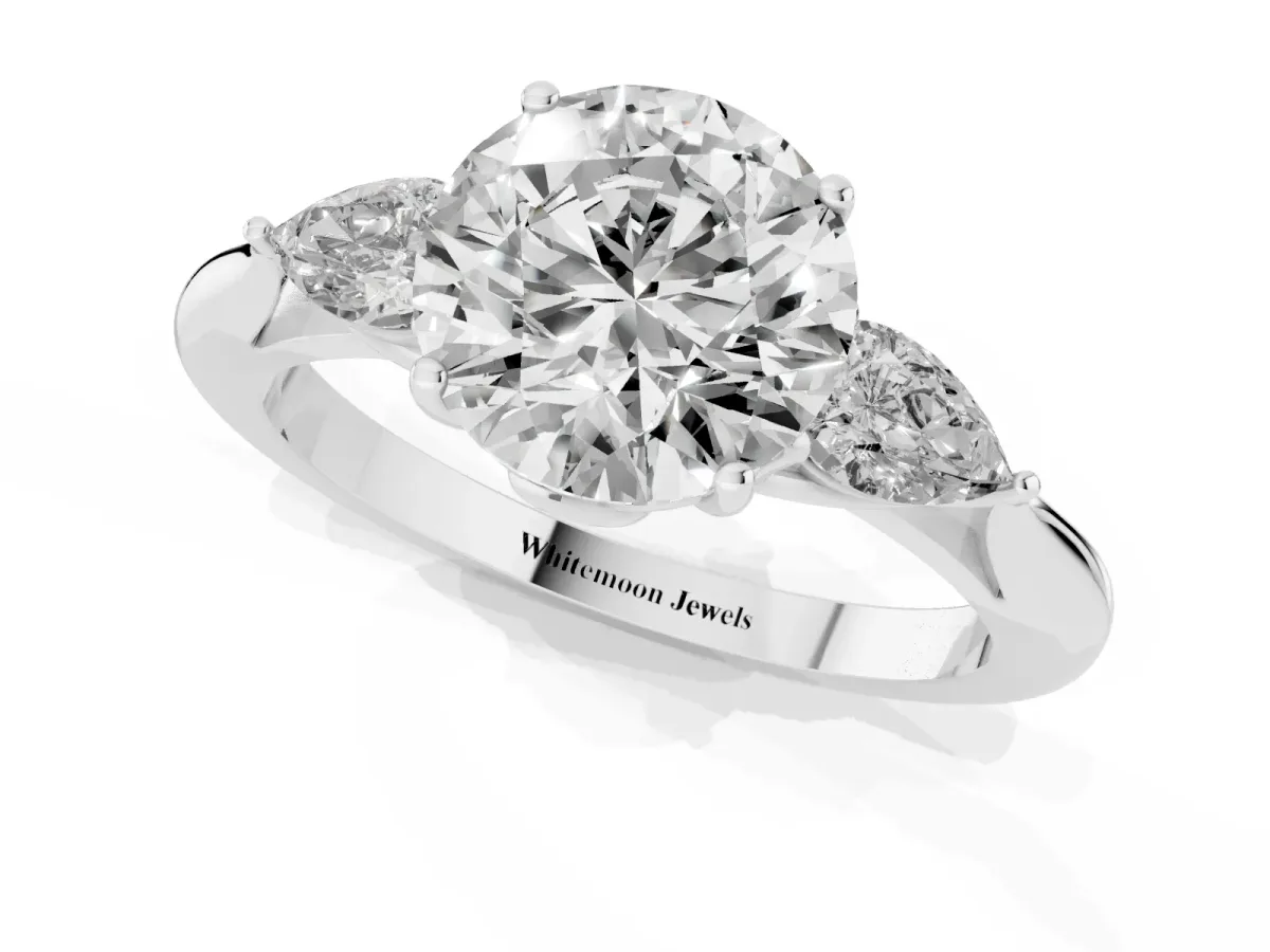 Three-Stone Round Cut Diamond Ring with Pear Side Stones in Four-Prong Setting Silver
