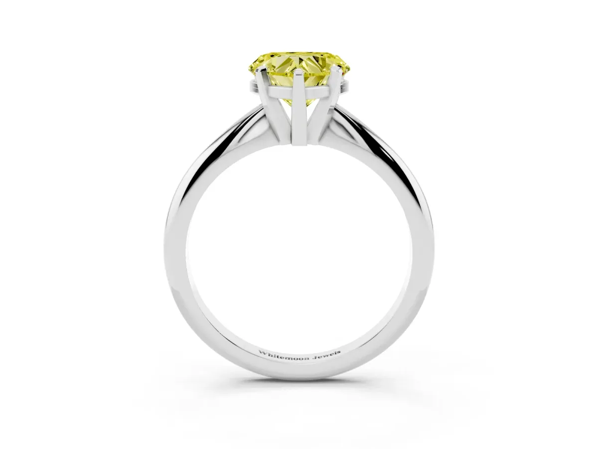 Fancy Yellow Heart Cut Cut Solitaire Ring with Four-Prong Setting on a Classic Band Silver