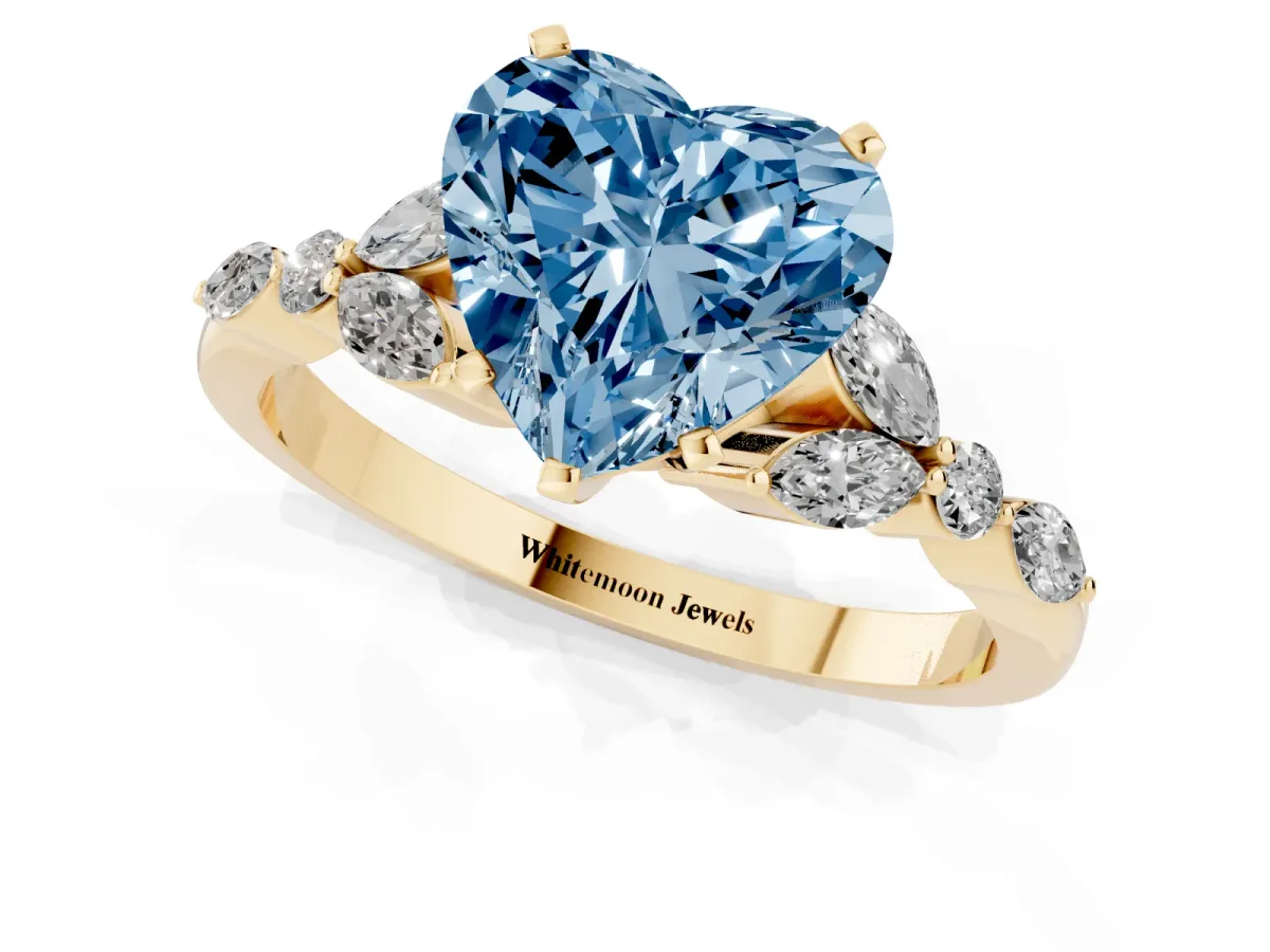 Fancy Blue Heart Cut Diamond Solitaire Ring with Side Stones and Four-Prong Setting Yellow gold