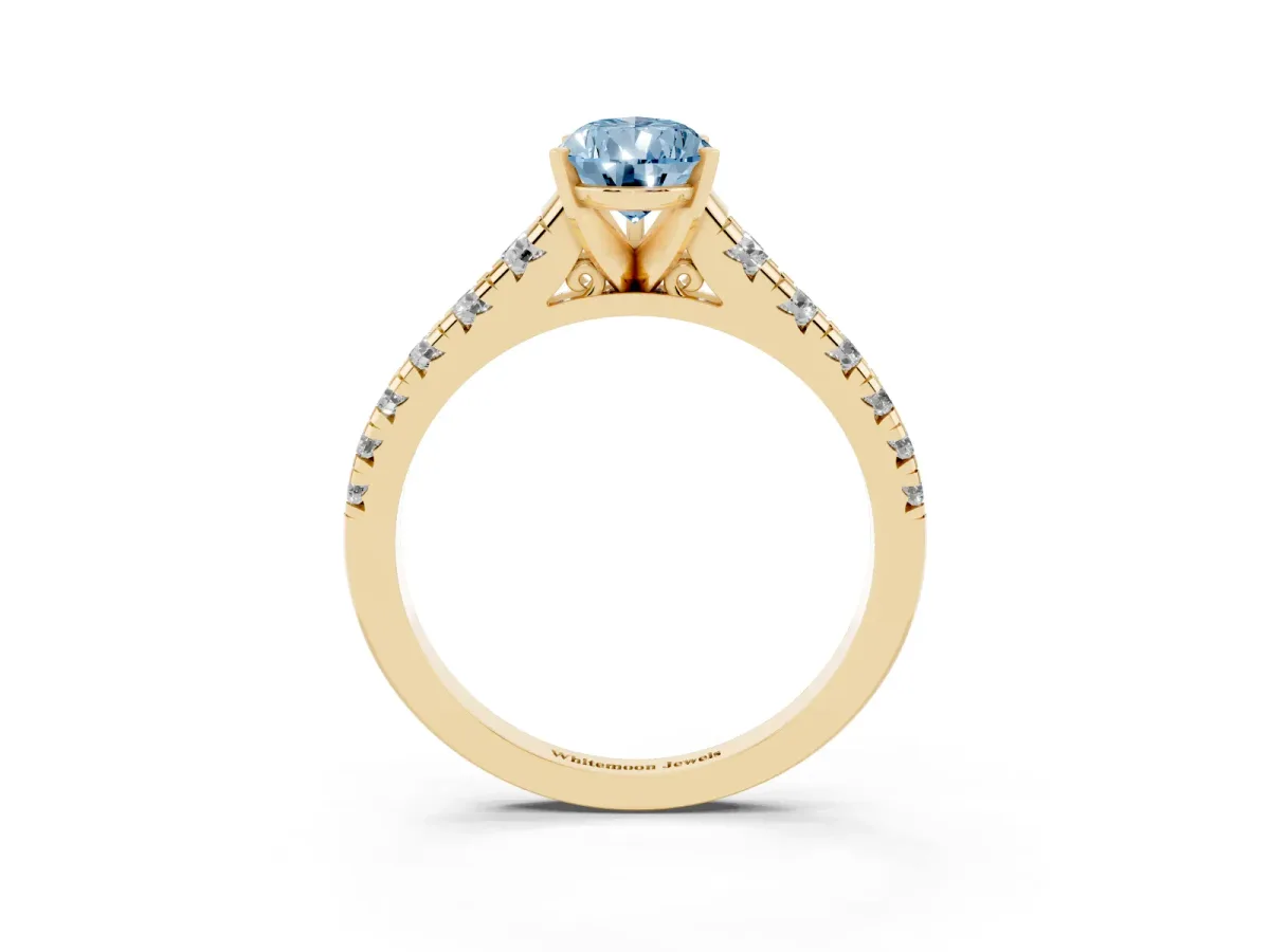 Fancy Blue Pear Cut Diamond Cathedral Solitaire Ring with Round Pavé Band Yellow gold