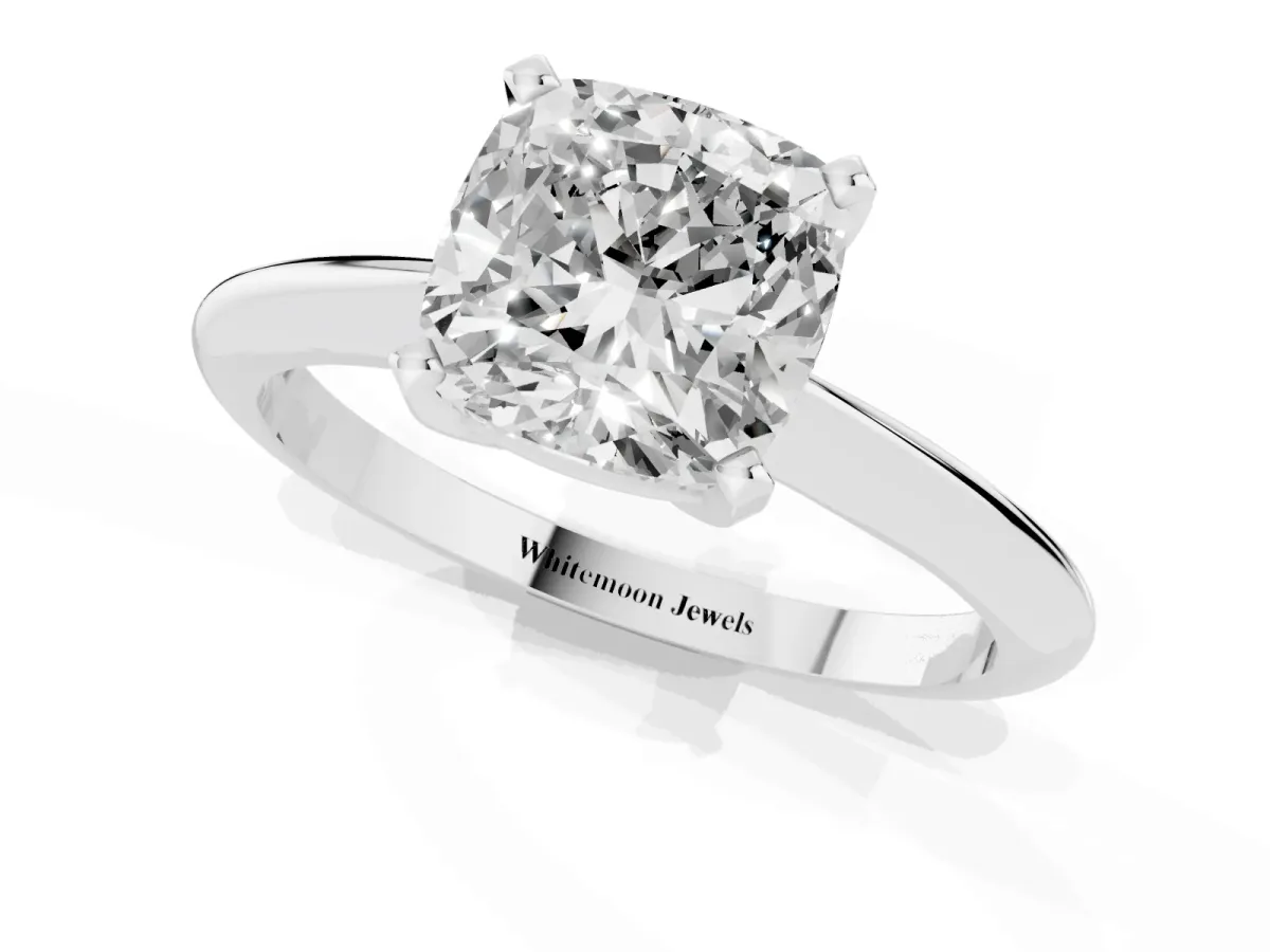 Cushion Cut Cut Solitaire Ring with Four-Prong Setting on a Classic Band Silver
