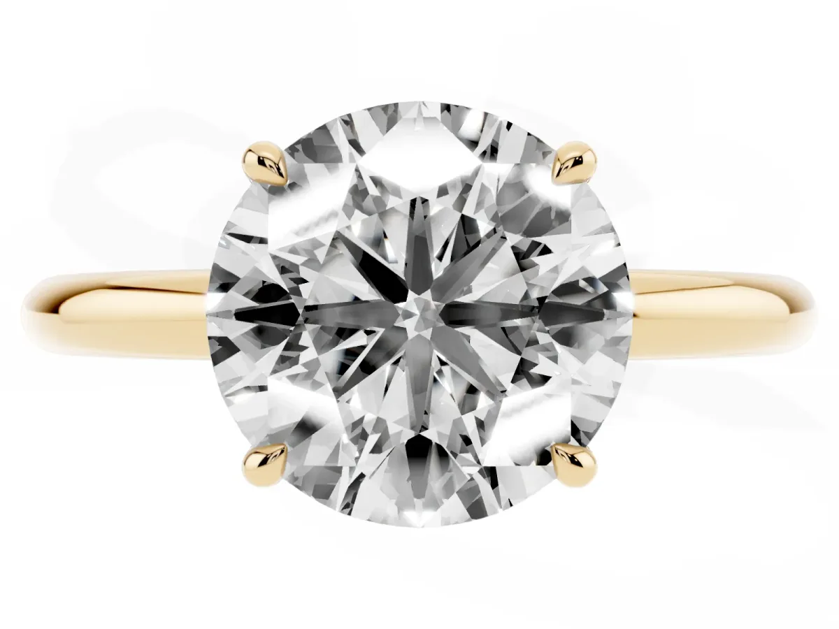 Round Cut Diamond Solitaire Ring with Thin Band and Four-Prong Setting Yellow gold