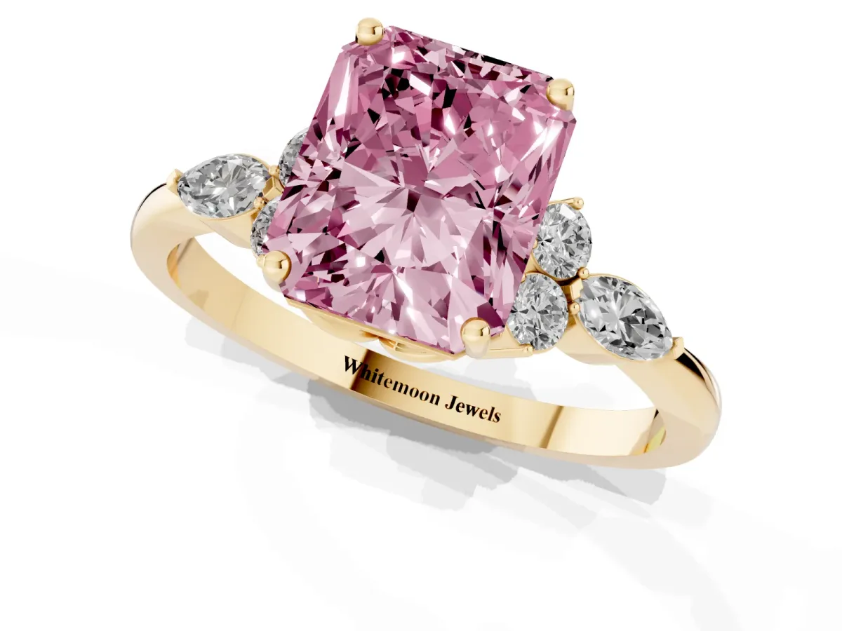 Fancy Pink Radiant Cut Brilliant Diamond Solitaire Ring with Pear Side Stones and Four-Prong Setting Yellow gold