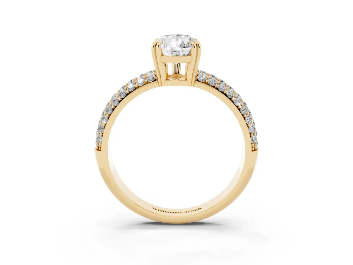 Pear Cut Diamond Solitaire Ring with Multi-Row Round Pavé Band and Prong Setting Yellow gold