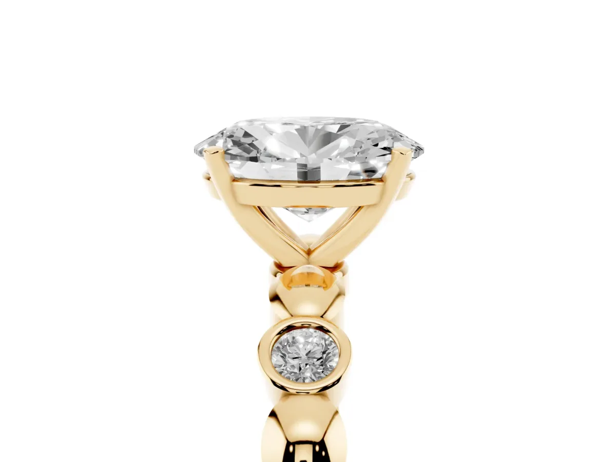 Oval Cut Solitaire Bezel-Set Diamond Ring with Beaded Band and Four-Prong Setting Yellow gold