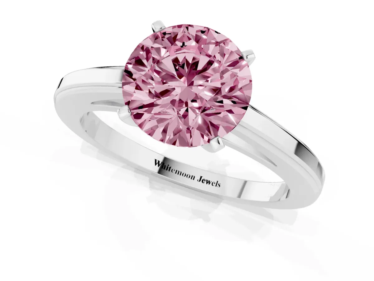 Fancy Pink Round Cut Solitaire Diamond Ring with Four-Prong Setting and Classic Band Platinum