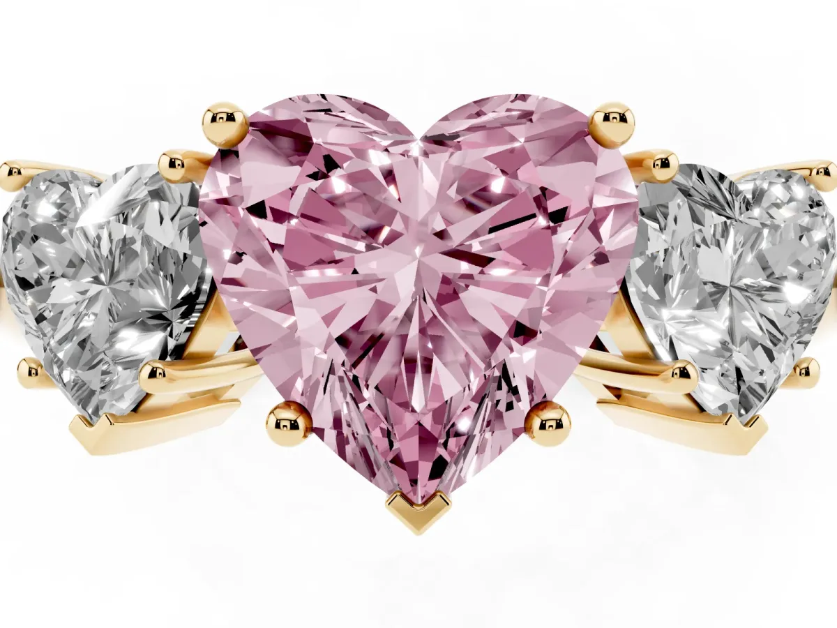 Fancy Pink Three-Stone Heart Cut Cut Diamond Engagement Ring with Prong Setting on a White Gold Band Yellow gold