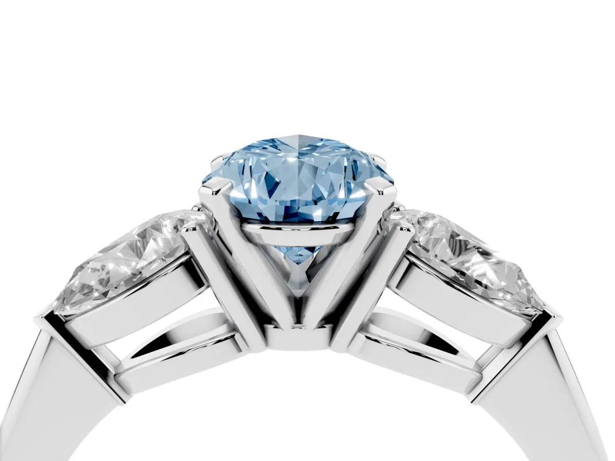 Fancy Blue Three-Stone Pear Cut Diamond Ring with Pear Side Stones and Four-Prong Setting Silver