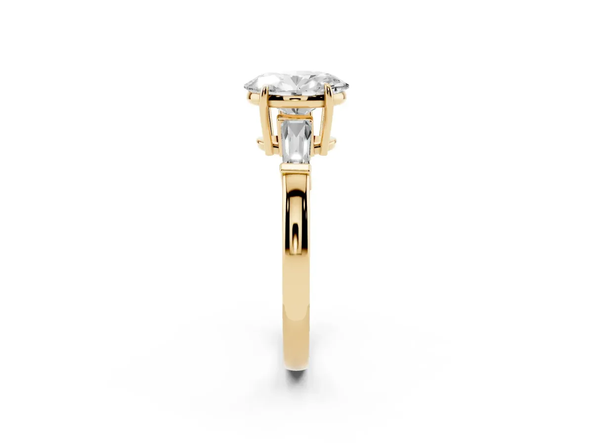 Oval Cut Diamond Three-Stone Ring with Tapered Baguette Side Stones and Prong Setting Yellow gold