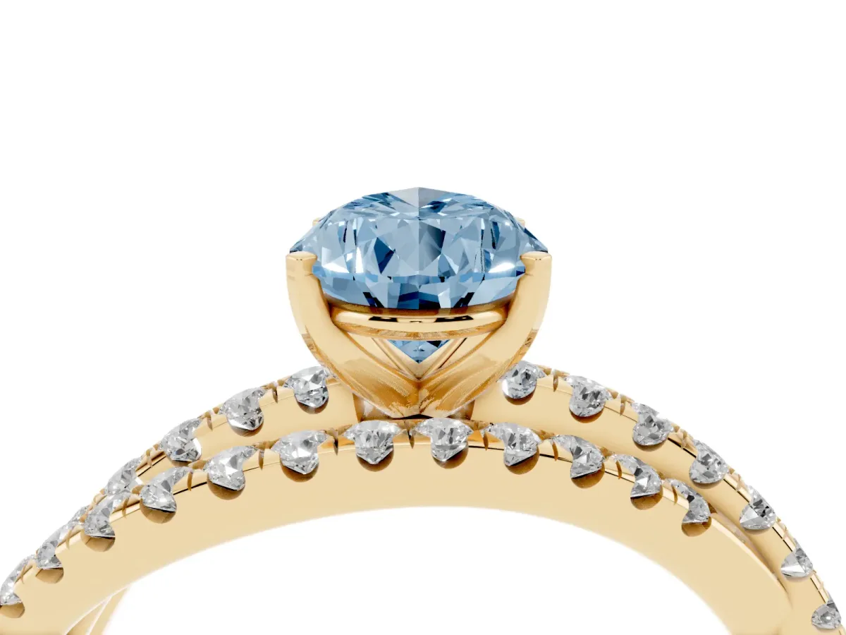 Fancy Blue Pear Cut Solitaire Twist Band with Pavé Setting and Four-Prong Setting Yellow gold