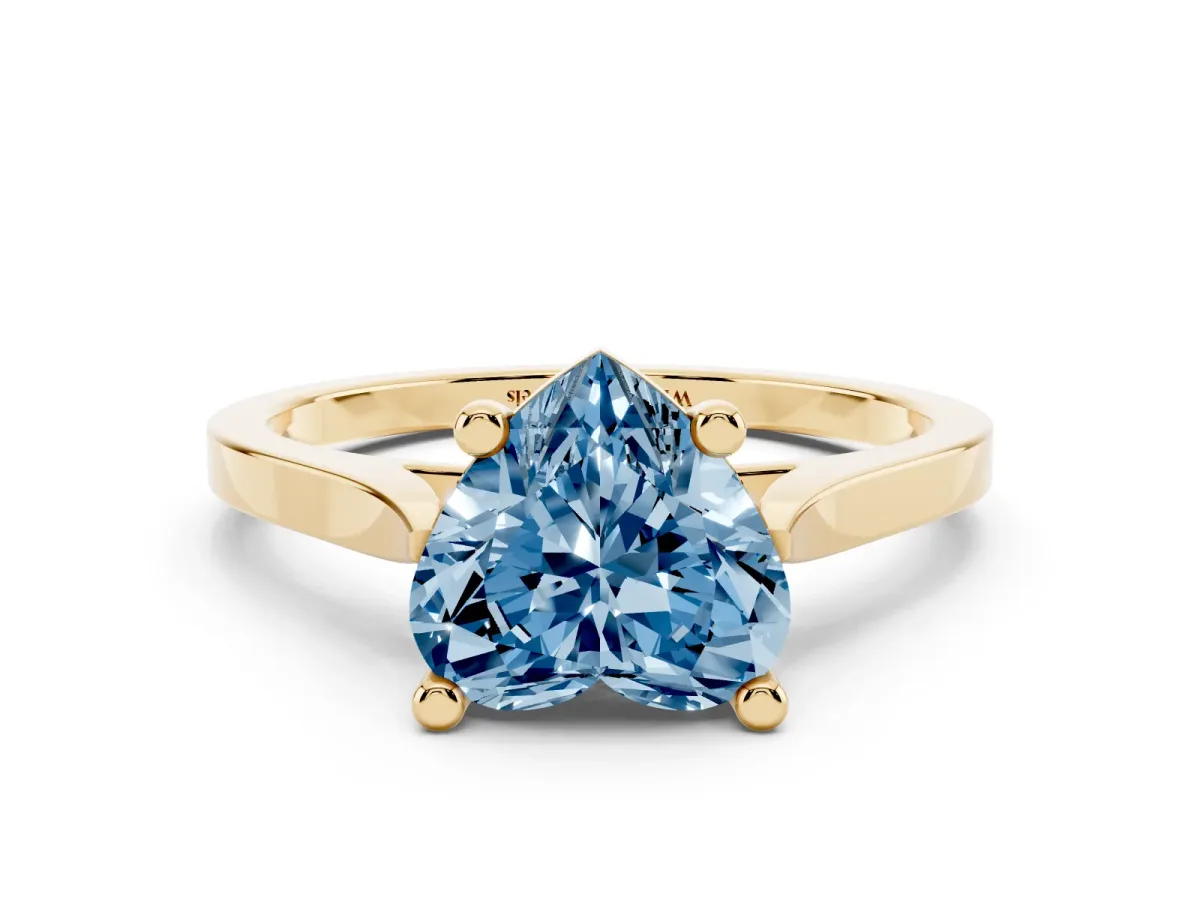 Fancy Blue Heart Cut Solitaire Diamond Ring with Four-Prong Setting and Tapered Band Yellow gold