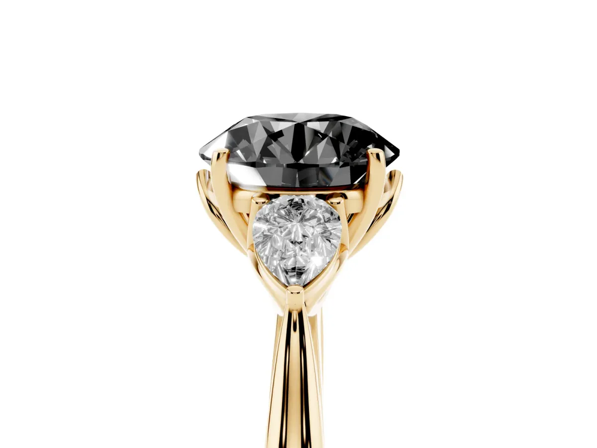 Fancy Black Round Cut Diamond Three-Stone Ring with Pear Side Stones and Prong Setting Yellow gold