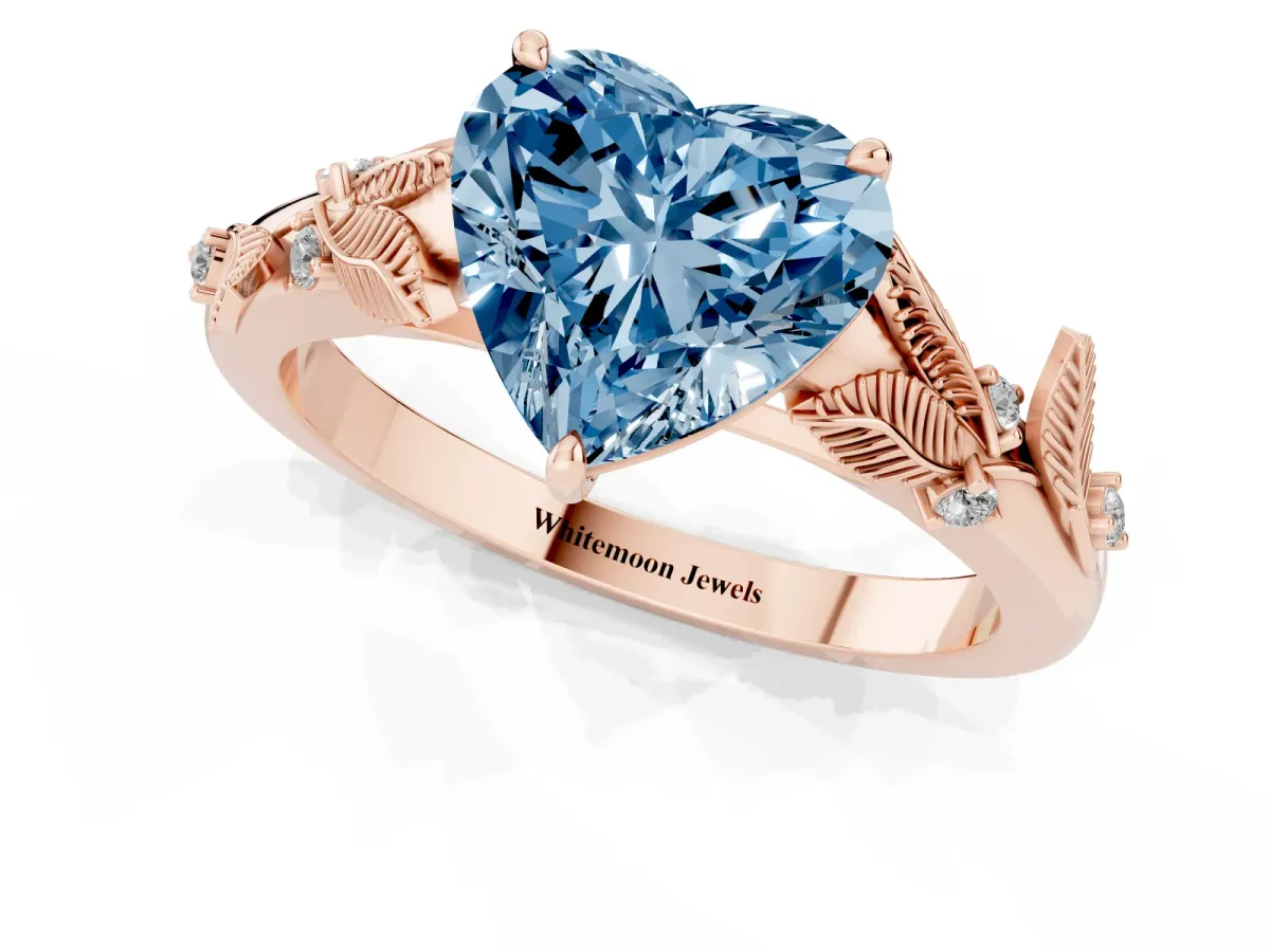 Fancy Blue Heart Cut Diamond Solitaire Ring with Leaf Motif Band and Four-Prong Setting Rose gold