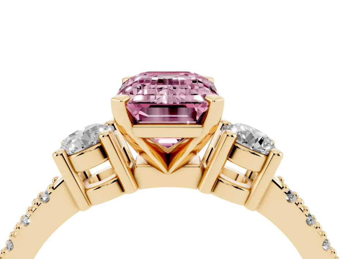 Fancy Pink Emerald Cut Three-Stone Diamond Pavé Band with Prong Setting Yellow gold