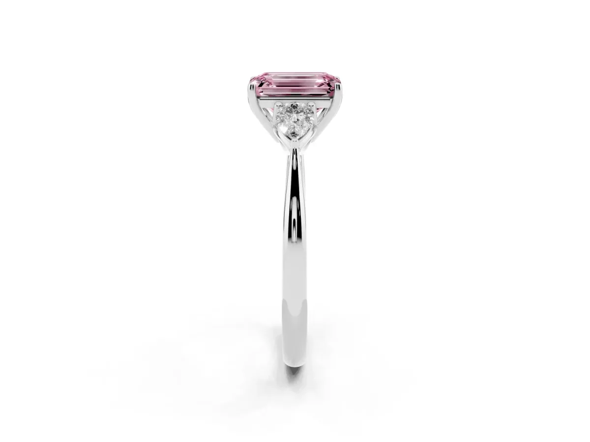 Fancy Pink Three-Stone Emerald Cut Diamond Ring with Pear Side Stones in Four-Prong Setting Platinum