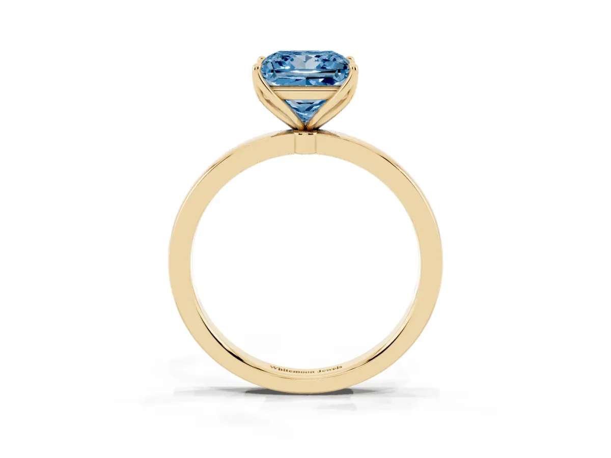 Fancy Blue Princess Cut Diamond Solitaire Ring with Thin Band and Prong Setting Yellow gold