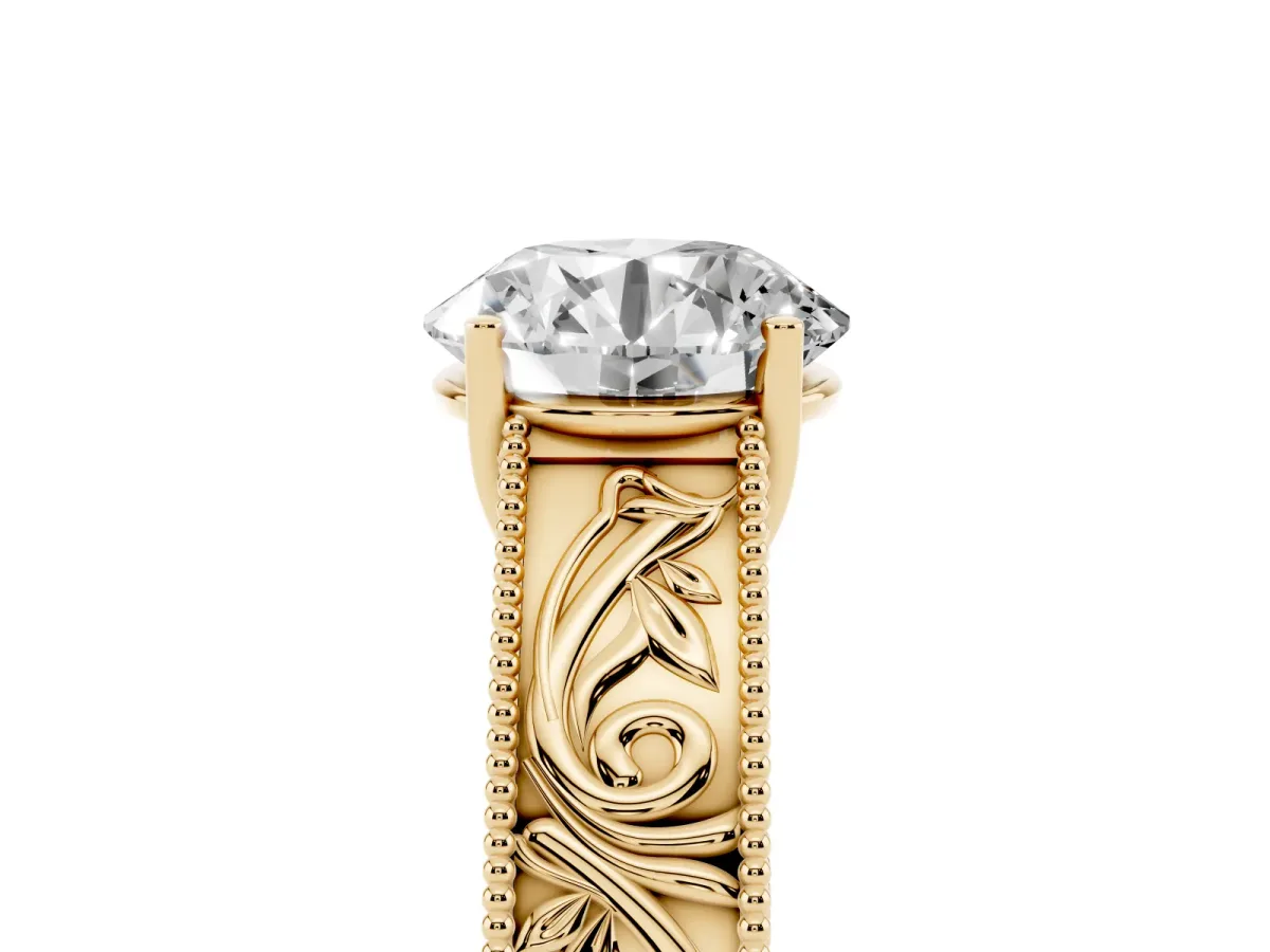Round Cut Diamond Solitaire Ring with Engraved Band and Four-Prong Setting Yellow gold