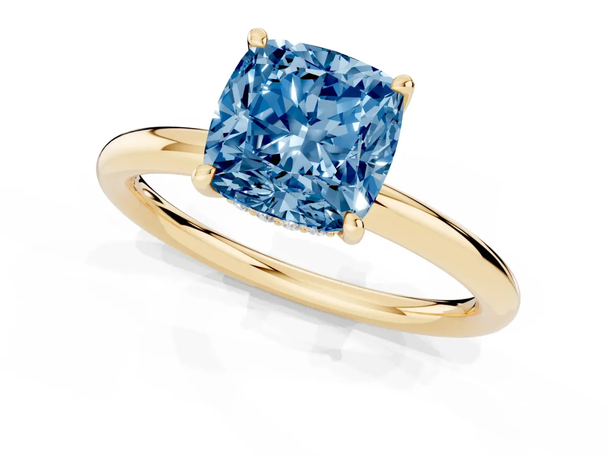 Fancy Blue Cushion Cut Diamond Solitaire Ring with Thin Band and Four-Prong Setting Yellow gold
