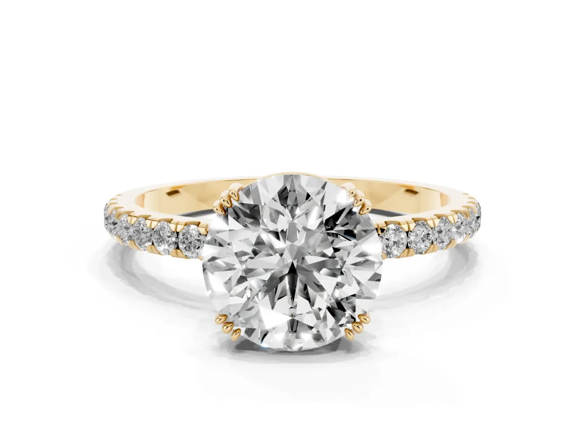 Round Cut Brilliant Solitaire with Pavé Band and Claw Prong Setting Yellow gold