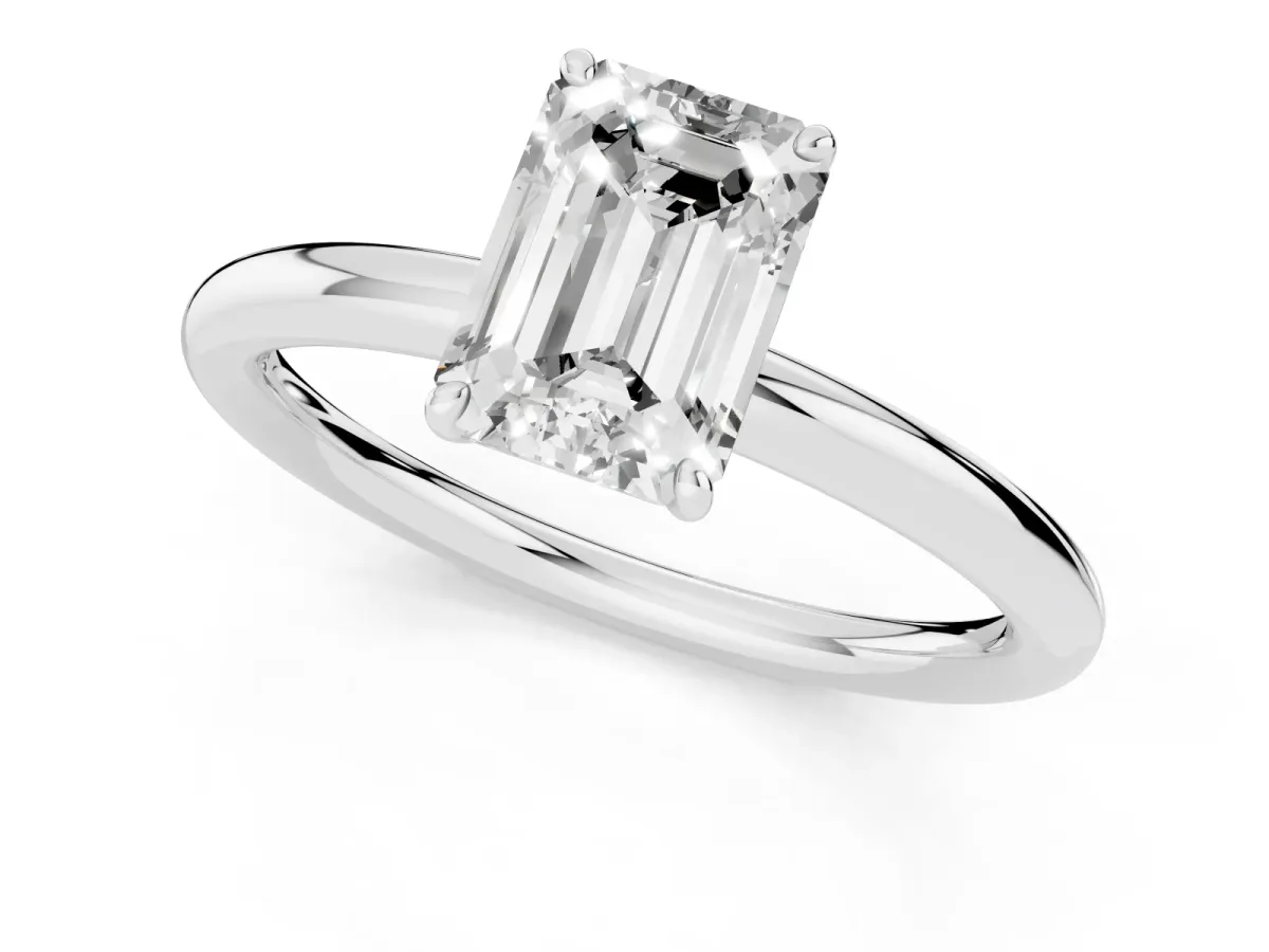 Emerald Cut Solitaire Diamond Ring with Four-Prong Setting on a Plain Band Platinum