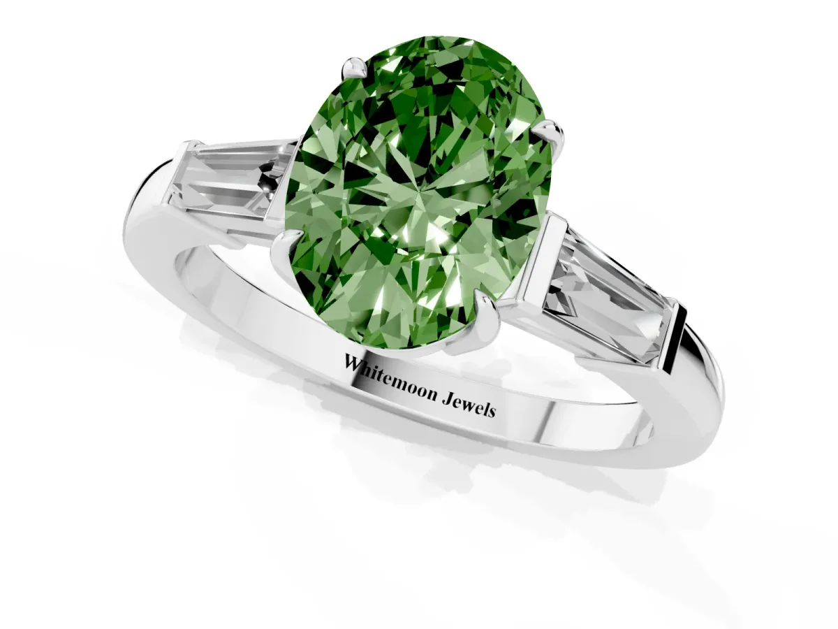 Fancy Green Oval Cut Diamond Three-Stone Ring with Tapered Baguette Side Stones and Prong Setting White gold