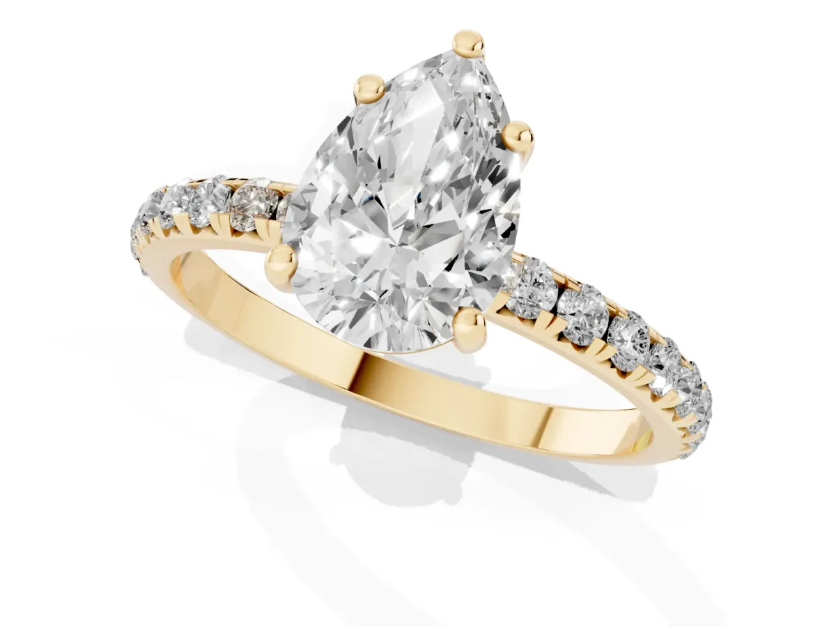 Pear Cut Cut Diamond Solitaire Ring with Micro Pave Band and Four Prong Setting Yellow gold