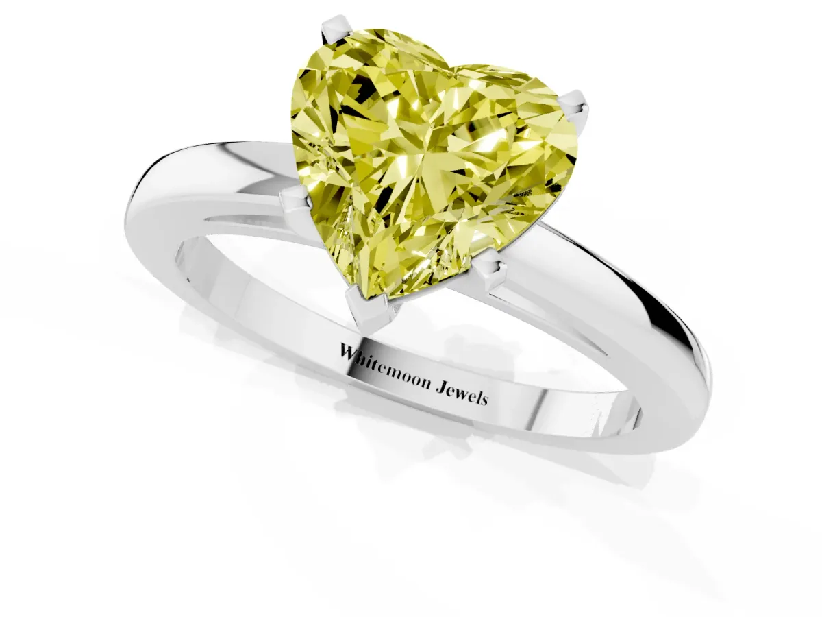 Fancy Yellow Heart Cut Solitaire Diamond Engagement Ring with Four-Prong Setting on a Classic Band Platinum