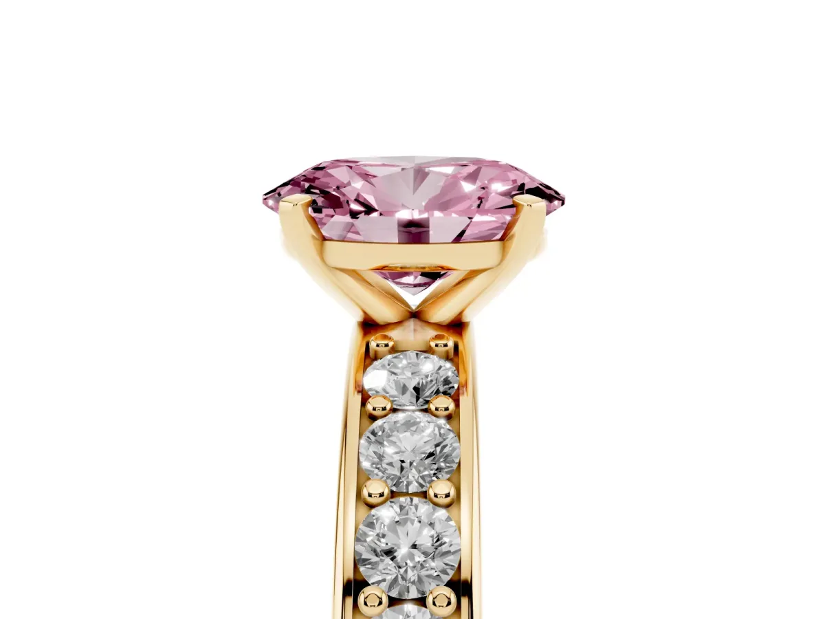 Fancy Pink Oval Cut Diamond Engagement Ring with Channel Set Round Band and Prong Setting Yellow gold